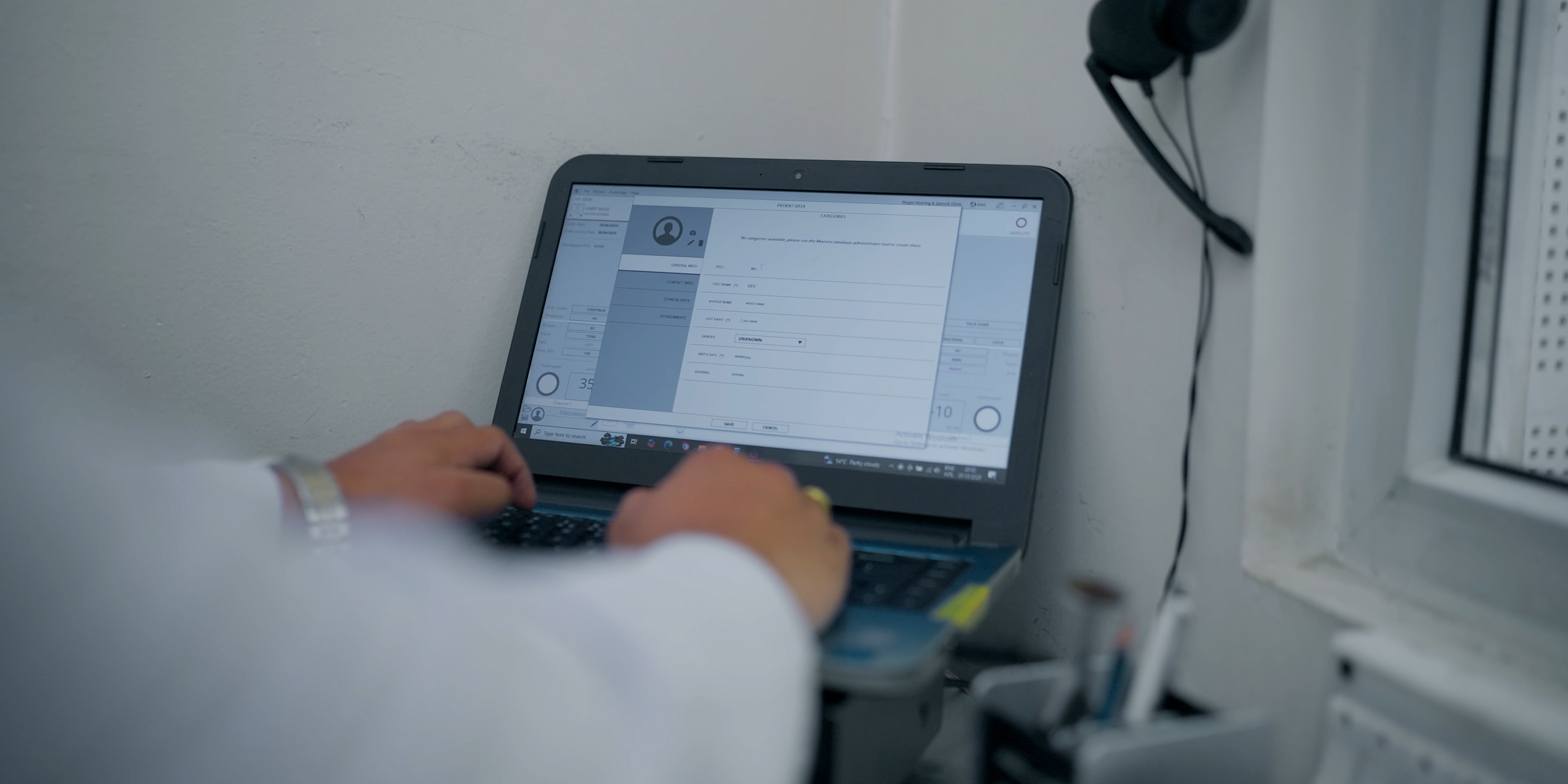 Audiologist consulting a patient